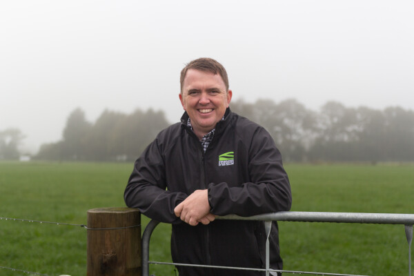 Photo of Wayne Langford, Board member leaning on a fence